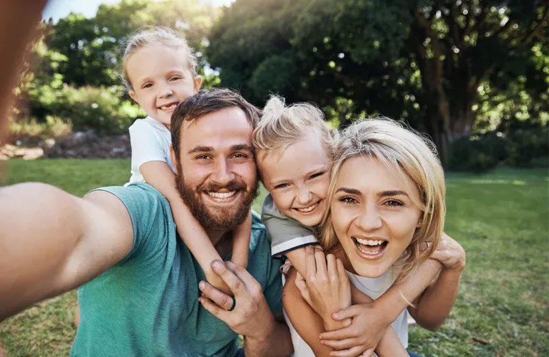 Family outside mosquito free back yard