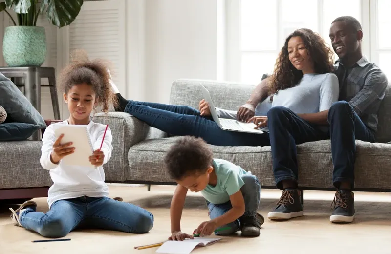 family relaxing in living room