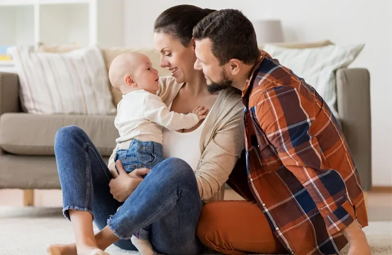 family relaxing with baby in pest free home