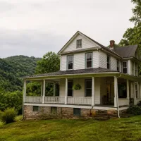 White home with wraparound porch in West Virginia