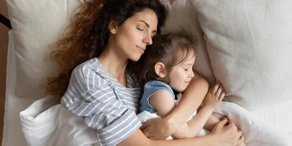 mother and daughter sleeping comfortably